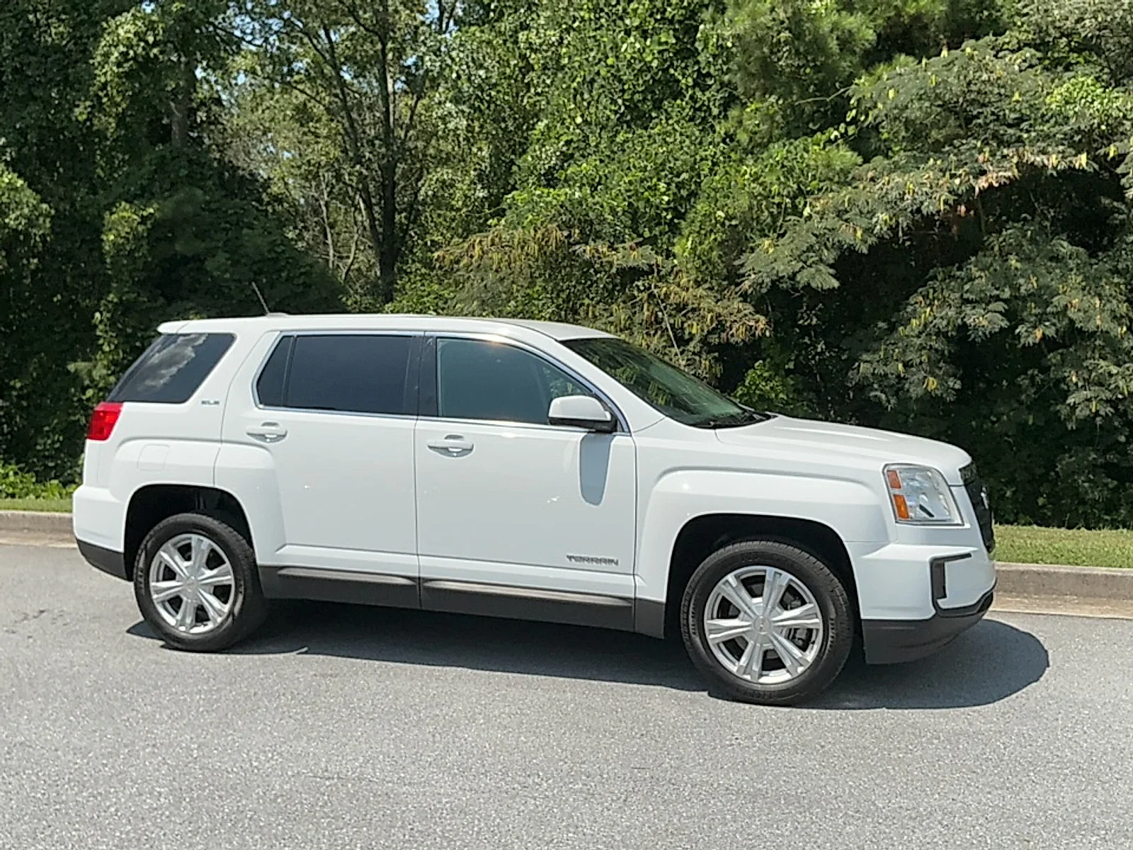 Customer reviewing used car financing paperwork near East Syracuse